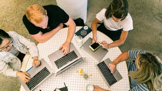 four people using laptop computers and smartphone 3277808