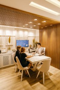 three person sitting on dining set 3285195