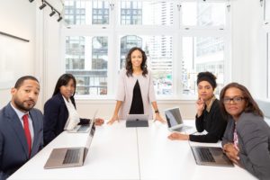 Woman Standing On The Center Table With Four People On The 1367271